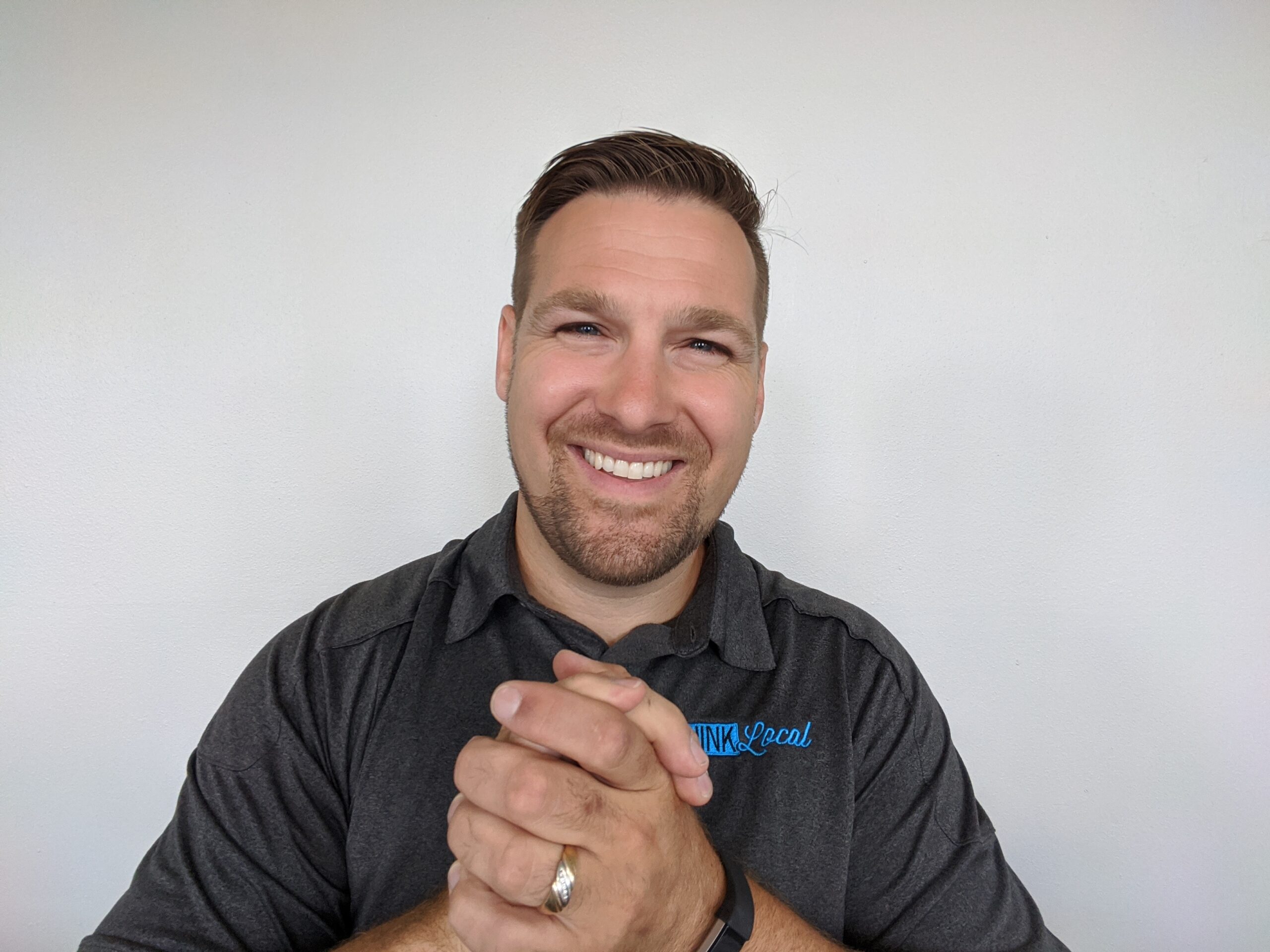 Ben Palmer White background, Gray shirt, Ben smiling